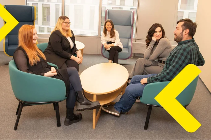 A diverse team of professionals having a meeting in a modern office setting
